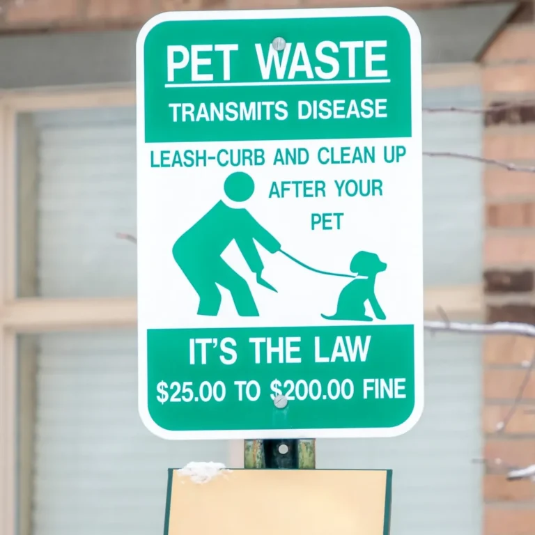 Sign that says to pick up after your dog because pet waste transmits disease